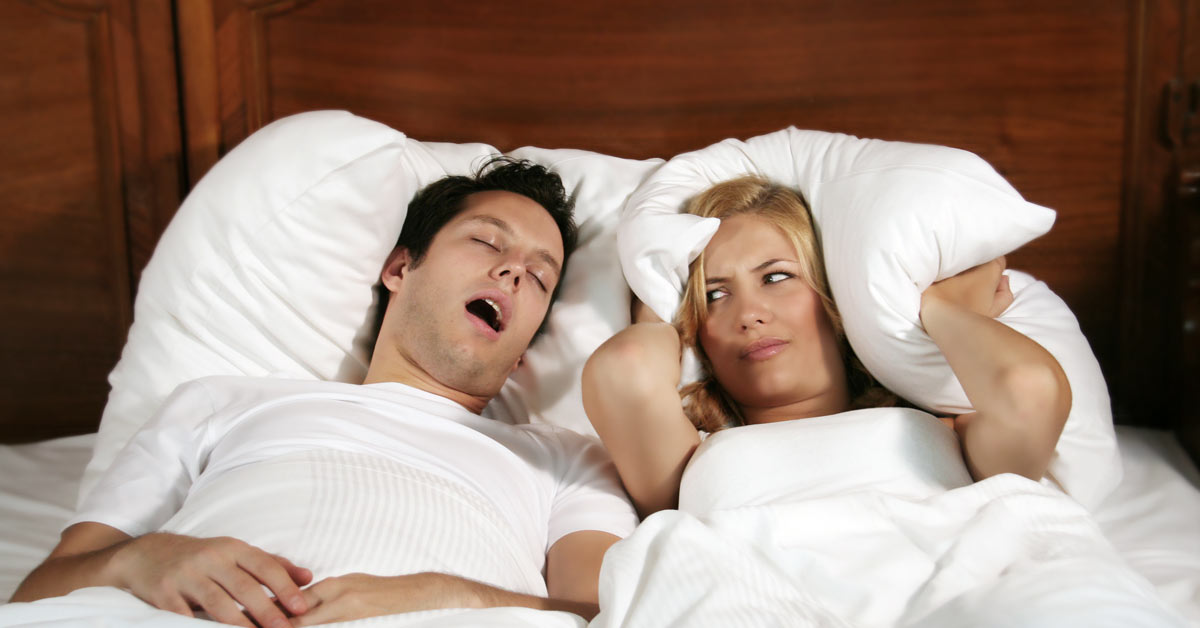 Image of a couple snoring