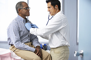 A patient receiving a DOT physical exam from a doctor