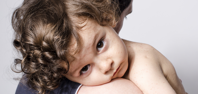 Parent holding toddler